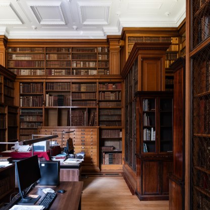 Entrance to the Museum's Reference library; a glass door with "Reference Library" etched on and looking through to the library itself